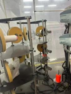 Yarn feeding control system for FR fabric weaving and greige fabric preparation